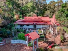  60C Croyden Road Roleystone WA 6111 $600's This 3 bedroom solid weatherboard and iron home is simply magical! The wide verandahs take in stunning valley views and is super private in every direction. The minute you arrive you will be drawn in by its charm. Starting with a fenced and gated garden with a variety of productive fruit and citrus trees. There is a beautiful circular recycled brick parking area. Beautifully restored and lovingly maintained, you will be able to just move in and enjoy. You will find a stunning outlook to enchanting valley views from this sought after and whisper quiet location. This home boasts many period features like warm timber floors, two open fireplaces plus two slow combustion wood heaters. There are high ceilings and multiple french doors throughout, allowing the cool summer breezes to waft through. Some modern conveniences include four reverse- cycle air conditioners. The master bedroom is fit for royalty. It is extra large with enough room for huge antique furniture or a sofa. Also with your own open fire and magnificent timber mantle. French doors allow you to spill out to the verandah area for that morning cup of tea. Definitely a garden for all seasons you will find lots of relaxing and private sitting spots in the awesome cottage gardens, both under cover and amongst the shady trees. Right now the the autumn leaves have fallen and a new mood has arrived. Just wonderful! As a bonus at the end of a meandering path you will find a timber building. If you have ever hankered for a studio, well this could easily transform to your dream. Views from here too, through the louvre windows. It is very easy to get excited about this whole property, just look at the photos. Don’t delay making an appointment to view this delightful property. Secure it for your family today. 