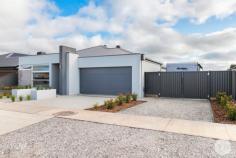  14 Mary Drive Alfredton VIC 3350 $715,000 - $730,000 This stunning family home is sure to impress upon immediate entry, showcasing modern, sophisticated living. Situated on a generous sized allotment of 630m2 (approx) & located in the exclusive Alfredton Central estate, the location & property on offer is of the highest standards & is sure to amaze. • This brand new Hudson Ridge home is a complete family set-up boasting four bedrooms, 3 with BIR's plus the incredible master suite comprising of a huge WIR complete with joinery & a luxurious dual vanity ensuite with separate toilet. • Upon entering through the 1200mm wide front door, the impressive 2.55m high ceilings & feature lighting ooze quality & class and set the tone for the entire property • There are two separate living zones including front formal living room with built-in study nook & entertainment unit plus an open plan family room with premium gas log fire creating a sense of ambience • The kitchen is simply stunning and offers gas & electric cooking, Caesarstone bench tops, breakfast bar & incredible walk-in pantry with plumbed fridge space • Some of the other standout features include ducted heating & refrigerated air conditioning throughout plus quality fittings & fixtures • Beautifully landscaped with low maintenance in mind, there is a large, undercover entertaining area & a separate fire-pit area • Completing this impressive home is the oversized double lock up garage and secure side access to store your caravan, boat or trailer • Ideally located in the Alfredton Central estate, close to multiple high schools, Lucas shopping & the Ballarat Golf Club. 