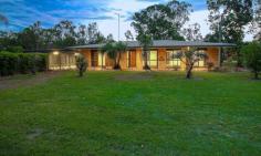  599 Brisbane Valley Highway Wanora QLD 4306 $695,000 Here is your chance to grab your piece of paradise. This beautiful low set brick home sits on 8 acres of serene rural land, which once served as a tomato farm. Whilst the property is in a very private location, it's only a 15 minute drive to Ipswich City and Riverlink Shopping Centre via direct access to the Brisbane Valley Highway plus also just 50kms from Brisbane. This family home is perfect for anyone looking for a peaceful escape, whilst keeping the city at their fingertips. Features of the property include: • 	 4 bedrooms, 3 with built-ins and the main with air-conditioning • 	 Main large bathroom with shower and bath combination and heaps of storage • 	 Spacious laundry with plenty of storage with second stylish bathroom attached • 	 Open plan kitchen with breakfast bar, double fridge space and plenty of bench and cupboard space • 	 Formal dining room with beautiful great views of the back garden • 	 Large carpeted living area with air-conditioning and large sliding doors • 	 Second living area also with large sliding door leading into the fenced back garden • 	 Spacious outdoor entertaining area with the pool all fenced in for privacy • 	 Front and back verandas connecting the living areas • 	 Covered carport which comfortably fits 4 cars and extra lockable storage or tool shed at the back • 	 Security doors and windows throughout • 	 Glamorgan Vale rural water connected to the property • 	 Large barn, chicken coupe and 2 powered storage sheds • 	 Stunning in-ground salt water pool • 	 2 water tanks holding approximately 60,000L combined • 	 Secure property with fences throughout, perfect for young children and pets • 	 Easy access to the Brisbane Valley Highway • 	 Not to mention a tranquil rural outlook An opportunity not to be missed - if you are ready to start living the good life, here is your chance. Call Neil Mundy on 0409 893 842 now to organise a private inspection or for any further information. FEATURES: • 	 Massive Entertainment Area.. 
