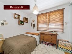 12 Ambon Rd Holsworthy NSW 2173 Features: • R3 Medium Density Zoning • Total land approx. 556sqm • Frontage approx. 16.15m • Potential rental return approx. $46,000 p.a Main Residence: Three-bedroom home that has been tastefully updated throughout and offers casual living area, polished timber floor boards throughout, with a large covered deck area and side access. • 3 bedrooms with built in robes • Timber floors throughout • Renovated Kitchen • Split system air conditioning • Renovated laundry • Gas heating and cooking Modern Nearly New Large 2 bedroom Granny Flat: Stylish modern design 2 bedroom Granny Flat. 12A Holsworthy has a private footpath to the side of the main residence as well as separate bins and a separate mailbox. • 2 Modern bedrooms with built ins; • Split system top of the range Daikin air conditioning unit • Continuous gas flow hot water • Combined large size laundry/bathroom • Stylish modern polished concrete floors • 45SQM backyard entertaining/courtyard area with home made pizza oven. The Property is conveniently positioned close to Holsworthy train station, M5 Access and only moments to local schools and Wattle Grove Shopping Centre. 