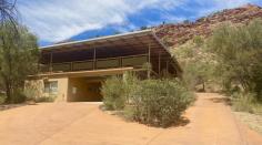  46 Lillecrapp Road Ilparpa NT 0873 $1,100,000 46 Lillecrapp Road is a piece of perfection. From the amazing panoramic views of the famous Macdonnell Ranges to your very own parent’s retreat, granny flat, or guest house… its certainly one for the taking! Located on a 2.5-acre allotment in the highly regarded area of Ilparpa, this five-bedroom four-bathroom home is simply spectacular. Take back your weekends, and spend more time with family and friends, nestled in your own private oasis. Upstairs Featuring – Modern & spacious open plan kitchen, dining, and living area, tiled with air-conditioning and ceiling fans. The kitchen offers ample bench and cupboard space with a walk-in pantry, stainless steel appliances & mass natural lighting. Four generous-sized bedrooms, all including built-in robes, a continuation of tiled flooring, air-conditioning, and ceiling fans. A stunning deck surrounding the top floor overlooks the breathtaking views and a second paved outdoor entertaining area sits at the rear of the home dividing the main house from the sleeping quarters. Downstairs featuring – A guesthouse with tiled flooring, kitchen area with air-conditioning, and large studio space to be utilized as you wish. Alongside this area is the lock-up garage/parking space for two cars. Additional to the garage is a large carport located on the same level as the main house allowing easy access with groceries and down the hill with plenty of space to potter about sits the large powered shed. – 5 Bedrooms, 4 Bathrooms – Dual living with furnished granny flat – Air-conditioning and ceiling fans throughout – Stunning panoramic views – Water tanks – Solar Voltaic Panels – Large powered shed with storage rooms – 2 x Dual carports This property is a rare find and will not last long. Private viewings welcome. 