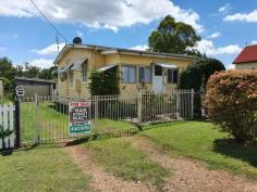  14 James St Blackbutt QLD 4306 $290,000 This property is in walking distance all amenities, Built in veranda at the entrance, 2 small bedrooms at the front of the house. Main bedroom off the lounge room with large built in wardrobe, ceiling fan and split system air conditioning. Lounge room with r/c air conditioning, bedrooms and lounge are carpeted. Kitchen has an electric stove top and wall oven, pantry, and shelf for the microwave. Bathroom with shower over bath and vanity, separate toilet and separate laundry area. Tiled covered entertainment area out the back, older style lock up garage, rain water tank and lovely established gardens. This property in currently tenanted and 24 hrs notice is needed to view. 