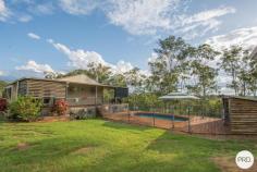  41 Lirema Court Delan QLD 4671 $550,000 Set in the quiet cul-de-sac of Lirema Court, overlooking 5 acres of cleared and natural bushland is a near new cottage with all the mod cons, and a spacious granny flat nearby. Both overlooking a beautiful pool, solid timber gazebo, and the serene Aussie bushland with hinterland mountains views. This spot is just beautiful and one for the nature lover. Peaceful countryside living with established landscaping, gardens & lawns at the front of the block. Just the spot to let the kids and the dogs run free. The entire 5 acres is dog fenced, with the internal house yard fenced separately. The balance of the acreage is natural bushland - perfect for exploring and letting a horse & sheep roam happily. Residence: Attractive steel framed colorbond home surrounded by wide timber veranda & deck. This is an established low maintenance home that has entertaining & a love of the outdoors at its forefront. - Near new home approx. 6 years old - Modern kitchen with 4 burner gas cooktop & stainless steel rangehood & dishwasher. Glass & stainless steel splashback, waist-height oven, plenty of pot drawers and cupboards all 'soft close' closing. - Open plan kitchen, living & dining flows & overlooks a great entertaining space and outdoor living. - Living areas - airconditioned, ceiling fans, and feature a wood burner fireplace for the cooler nights. - Spacious Main Bedroom with large storage room, walk-in-robe or office space - Bedroom 2 can be utilised as extra living space as it features a fold-up in-wall Bed - Large 'ceiling to floor' tiled Bathroom with corner tub, shower with rainhead shower rose, vanity and separate toilet. - Downlights, security screens, air-conditioning, modern tiles & timber look flooring throughout this property. - 5kw Solar System for low power bills, and Maestro Roof ventilation control system which removes heat in summer & humidity in winter. - 2 x 2500 ltr rainwater tanks - Boundary of house yard is dog fenced and snake proofed Walk out onto the veranda/deck and find an outdoor kitchen! Perfect for entertaining! Further along the deck is access to the pool which features log cabin-look gazebo, and beautiful views. Ideal for summer evening bar-b-ques/pool parties or just enjoying the sunset! Granny Flat/Studio: - Converted shed with large living and bedroom space - could easily be divided into rooms if required, and has access to attached screened back patio area. - Kitchen & Laundry combined - Bathroom with shower, vanity and toilet - Airconditioning and Wood Heater feature here as well. - Covered front patio - 2 x 2500 ltr rainwater tanks Plus: - 2 Bay log cabin-look car & trailer shed - Large lawnlocker - Wood shed - Taj Mahal Chook Pen - Established Fruit Trees inc mango, citrus, bananas, dragonfruit & passionfruit - Large established veg patch. 
