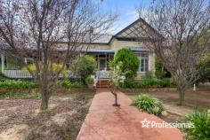  9 Gray Street Corowa NSW 2646 $799,000 This stunning Federation home built from 1898 to 1906 affords the new owner many options on this 1,056m2 approx. block. The traditional 4-bedroom home offers a spacious country kitchen with a 900mm freestanding cooker, walk in pantry, where the family can cook up a storm on the 3m central timber bench, and is afforded great storage in this inviting kitchen, the two separate spacious living rooms enjoy timber ceilings and lovely views, the breakfast room off the kitchen leads onto the verandah, the study comes off the rear landing and the master bedroom with ensuite and walk in robe has a separate entrance off Gray St, and a parking spot, the spacious renovated family bathroom is central to the bedrooms, the separate laundry is close by the kitchen making this a functional design, the double garage and potting shed and workshop area are all to the rear of the home and come off Parade Place. The charm of yesteryear abounds in this beautiful home where the amazing 12-foot ceilings, leadlight and stained-glass windows, metal pressed ceilings, large cornices, Murray River Gum polished timber flooring and spacious verandah will immediately impress. The home has been recently painted inside and out, and totally restumped. The outdoors offers alcoves for the family to relax and take in the leafy shaded areas to enjoy barbeques, with a serene pond, ready to watch the world go by from the wide verandah. Your climate is controlled by underfloor gas heating and an ambient gas heater to the living room, the cooling is assured with fans and split systems. The property also comes with a self-contained unit, offering an income stream of $175p.w. or additional space for the family, with one bedroom, kitchen, bathroom, lounge room and separate carport. 
