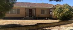  27 Johnston St Wongan Hills WA 6603 $285,000 4 bedroom 1 bathroom brick & tile home sitting on a generous sized 1126m2 easy care block.  Welcome! Through the front door to your left, you will find a generous sized carpeted living area, reverse cycle A/C for warmer days & heating for the cooler ones. To your right of the front door you will find the carpeted hallway leading up to 3 of the 4 bedrooms, bathroom & W/C.  The open plan dining / kitchen area is located off the living area. Double sliding glass doors seperate these two areas. The dining is carpeted with sliding doors allowing access to back patio area, while the kitchen has laminate flooring, reverse cycle A/C, single stainless steel sink, gas cooking, in built pantry & seperate cleaning storage cupboard.  The laundry is accessible via the kitchen, but also the hallway area. The laminate flooring in the kitchen flows through to the large open laundry area. The laundry has access to the back patio area. Large 170L Midea HWS located in corner of back patio area.  The master room is carpeted, has large floor to ceiling built in robes & reverse cycle A/C.  Bedroom 2 & 3 are both carpeted & also have a reverse cycle A/C.  Bathroom is central to the home with wall to wall mounted vanity, good sized mirror, large shower recess & heating/lighting/exhaust.  There is a small patio at the rear of the home with access to a spacious 4th bedroom, office, toy room or whatever your needs require. A small brick paved area at the base of the patio allows some more room for entertainment or a great place to sit back & watch the children enjoy the below ground swimming pool.  Large double garage for storage needs with side driveway access, accessible via Reynoldson Street. While there is a small garden shed located near the pool for all those pool storage needs.  Great location within walking distance to the local district high school, chemist, post office & IGA to name a few!!  