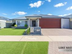  18 Ornata St Byford WA 6122 $500,000 Welcome to 18 Ornata Street Byford. This absolutely stunning super size 4×2 home is located in the highly sought after ‘Glades Estate’ situated on a family friendly low maintenance 510sqm block. With a total build area of 289m2 this gorgeous home will cater for the largest of families looking for expansive open spaces and double size bedrooms. With 3 big living areas and a stunning feature kitchen with scullery, this beauty with tick all your ‘I WANTS’ Boasting features galore this quality modern home is definitely a power house of the ‘Glades Estate’ With Woodland Grove Primary School, public open spaces just a stroll away and the Strand Lakeside Cafe and shops close, everything you need is on your doorstep, making this a highly sought after family home or investment. Selling features of this stunning home include: Fabulous street facade with portico entrance – Easy care front gardens with easy on the eye artificial lawns – Double remote garage with extra wide driveway – Feature front door with wide welcoming entrance – Shoppers entrance off the hallway – Hollywood style master suite with his and hers walk in robes – Open style feature ensuite with twin sinks separate WC and an intimate double shower – Huge theatre room with feature barn door entry – Jaw drooping open plan kitchen, meals, family and games area which is the hub of the home – Beautiful chefs kitchen with a mixture of soft closing cupboards and pot drawers, Westinghouse appliances, 5 burner gas hob, electric oven, dishwasher, double fridge recess and walk in scullery WOW – Large open plan meals, family and games area – 3 double size guest bedrooms all with built in robes – Super size guest bathroom with bath and shower – Good size laundry – Separate WC – Walk in linen – Timber decked grand alfresco and shade sail area – 2 artificial grass areas, one for the pets one for the kids – Garden shed and rear access to the backyard from the garage. Other features include: Ornate floor tiles throughout the thoroughfares and living areas – Roller shutter to the front master suite – Ducted reverse cycle air-conditioning – Attractive window treatments plus feature internal Plantation Shutters – Gas hot water system plus much more. 