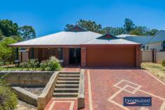  535 Horwood Rd Swan View WA 6056 $799,000 Options here with R12.5 zoning delivering the possibility to create a dual occupancy (STCA), subdivide now or later at the top of this elevated lot. Do it now or save it till later. Open the door to light filled living in this generously proportioned family home. Multiple living areas, easy – care landscaped gardens, and a large sheltered outdoor entertainment zone give a growing family flexibility. 4 bedrooms 2 bathrooms 2006 Summit brick & iron Open Plan central living Family-sized media room Separate activity room Main suite WI robe ensuite North-facing paved alfresco Easy-care landscaped gdns 1733 sqm with R12.5 zoning Close schools trail nat park Timber-look floors carry you along a wide central hallway past the spacious main suite, a separate media room, and on to a kitchen/meals/ family room arranged at the rear of the floorplan. Double doors connect this central living area to a separate activity room, while a sliding door to the large, north-facing alfresco entertaining creates seamless indoor-outdoor living. The galley-style kitchen features a long benchtop with an integrated breakfast bar, an electric oven, a 4-burner gas hob, and a dishwasher. Large windows fill this family hub with garden views and access to a paved outdoor living area surrounded by lawn, stone walls and a green screen of neatly clipped trees. An electric log fire at one corner of the open plan living space and ducted evaporative cooling throughout the home provide year-round comfort. The main suite sits at the front of the floor plan to offer a sense of privacy. Timber-look floors, timber blinds, and generous proportions create a calm and inviting parents’ retreat. A walk-in robe, split system air conditioner, and an ensuite with a separate WC bring comfort and convenience. A sense of space and pampering continues in the large media room, where plush carpet and ample room for a big screen and family-sized sofa set the stage for at-home movie nights. In the separate junior wing, three newly carpet bedrooms with built-in robes, a shared family bathroom with tub, shower, and vanity, and a separate WC give kids of all ages a space of their own. Family life can be hectic; this home is designed to make your days a little easier: a double garage with automatic entry, nearby schools, links to arterial roads, and easy access to walking and riding trails. And with the potential for subdivision or dual occupancy (STCA), multi-generational living or additional income could bring further benefits. 