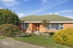  32 Baragoon Street HOWRAH TAS 7018 $725,000 Easy lifestyle This classic brick and tile property is beautifully presented and occupies a much sought after location in Howrah. Set on a much-favoured corner allotment the home is bound to attract buyers looking for level entry with few stairs to contend with and easy maintenance grounds. Howrah Beach is just over a 1km walk away whilst The Shoreline Shopping centre, several schools and many other amenities are only a short commute. Enjoy ever-changing mountain views and glimpses of the River Derwent. Level entry leads into the entrance foyer and flows into the living room, which enjoys plenty of sunlight through the large picture windows. The property has just had new carpet installed throughout and has a neutral colour scheme. Adjacent there is space for a family size dining table for those that like to entertain while the kitchen will definitely impress the chef in the household. Beautifully appointed with loads of custom cabinetry the Blackwood kitchen is highlighted with dark bench tops and has plenty of space for the avid cook to enjoy. There is a reverse cycle heat pump to keep the area comfortable year round. There are three bedrooms in the home with two being of exceptional size, both with built in robes. The bathroom has a bathtub, separate shower and vanity. The laundry has direct access to the rear gardens. The fully fenced backyard is landscaped with mature plantings and plenty of scope for the green thumb to develop further. There is plenty of space for the children and furry friends to play. The single garage has space for storage and also has internal access directly to the house. There is a second off street parking area perfect to house the caravan or boat/trailer out of the way. Howrah is much loved for its beaches and recreational facilities together with the easy commute to the Hobart CBD. There is an array of great schools, shops and amenities with public transport very close by. First home, downsize or invest this property would be an impressive option in a great location. 