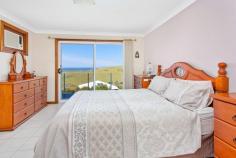  50 Kalang Road Kiama Heights NSW 2533 $1,995,000 - $2,100,000 Perched up high with breathtaking views over 'Loves Bay' and rural rolling hills lies this well maintained and modernised family home. Solidly built and having had just the one owner, this property enjoys plenty of natural light and an outlook most people dream of. Idyllically located in the Kiama Heights enclave this home is situated between the pristine 'Easts' beach & 'Loves' bay, coastal walking tracks and headland reserve, offering the coastal lifestyle change you have been dreaming of. This substantial home comprises of 5 bedrooms, master with ensuite and walk-in robe, 3 bathrooms, 2 separate living areas, impressive modern quality kitchen, drive-thru garage and large entertainment deck flowing effortlessly from the main upstairs living area. Additional features include fantastic storage, room in the garage for a workshop, above ground pool, 6.6kw solar panel, 2 x water tanks, split system a/c and potential to create self-contained flat with downstairs bedroom. Situated on an expansive 797sqm block with established gardens and surrounds, there is a feeling of space and plenty of room to grow your own vegetables or yard for the kids to run around. With this home already modernised throughout and a spacious entertainment deck off the main living room taking full advantage of the stunning coastal line, there will be plenty of time to entertain friends/family or sit back and enjoy vista. 