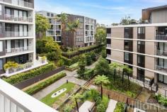  408/18 Birdwood Ave Lane Cove NSW 2066 Enjoying a green and leafy outlook, this one-bedroom apartment delivers unrivalled luxury in the heart of Lane Cove Village. Designed by Bate Smart Architects and built by renowned Australian firm Richard Crooks, the 'Quartet' development has rapidly earned the reputation as one of the most respected complexes within the area. Exquisitely appointed with a stunning Carrara marble and Miele-fitted kitchen, custom study nook and entertainer's balcony. Take a stroll through the manicured gardens to Lane Cove Village with its plentiful dining options, boutique shops, parks and express city buses. Conveniently located, the apartment is 500m to Lane Cove Village, 300m to major supermarkets Aldi and Coles and 150m to CBD bus route. • Contemporary elevated 4th floor one-bedroom apartment • Queen-sized, light-filled bedroom with built-in robe • Carrara marble full-sized gas kitchen with ample storage, Miele appliances • Designer bathroom with walk in shower and ample storage • Study nook with built-in desk, American Oak floors • Private covered balcony in an elevated position overlooking the internal gardens • Internal laundry, including dryer. Ducted air con. Lock up storage cage • Lift access from parking and street level. Security entry with video intercom. • Secure underground parking space. Plenty of visitor parking 