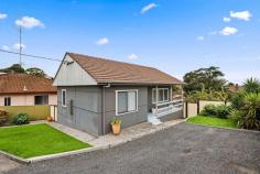  5 Minnegang Street Warrawong NSW 2502 $629,000 Occupying a spick-and-span block just 1km from Warrawong Plaza, this cosy home boasts an impressively spacious, free-flowing design to suit the young buyer or downsizer. Every room is neutrally schemed and features excellent proportions for modern living; the L-shaped lounge and dining area is particularly inviting, with lovely high ceilings, polished pine floors and windows on three sides. The internal laundry complete with second toilet and fully fenced child-friendly yard are certain to appeal, as will the convenient address steps to both local schools and only 10 minutes to Wollongong CBD. Features: Neat and north-facing in a peaceful residential street Renovated in 2019 and ready to be immediately enjoyed Air-conditioning unit, practical kitchen, shower room Oversized main bedroom, large second bed with built-in Linen press, shed + under-house storage, off-street parking Easy access to transport, lakeside, shops and beaches 