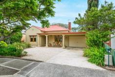  9 King St Glandore SA 5037 $1,050,000 to $1,150,000 Enjoying an enviable position along a quiet tree-lined cul-de-sac, you’ll find this renovated art deco home in wonderful company on King Street. A welcoming frontage with lovely timber-framed windows and a wide porch overlook neat front gardens and out to the street; the perfect place to muse with a morning cuppa. Generously proportioned with the distinctive high ornate ceilings, a central entrance is lined with timber floors and gives way to front positioned bedrooms on either side, including a roomy master with mirrored built-in robes and ceiling fan. A third bedroom is separated by a superbly refurbished bathroom accented with subtle neutral tones and a corner shower. Bathed in natural light, a rear family and dining area with large format tiles and a gas combustion heater is airy and open; timber framed café doors opening right up to reveal the ultimate alfresco entertaining space. Off to the side, a functional kitchen offers neutral shaker-style cabinetry, Asko dishwasher, wall oven, double sink, corner pantry, window opening onto the verandah and a servery and breakfast bar onto the family/dining. Here you’ll also find a convenient second bathroom with the charm of classic floor tiles, timber vanity and shower as well as plenty of room for all laundry facilities. A huge bonus also off the extension is a versatile extra room with split system reverse cycle air conditioner and doors directly onto the alfresco. A guest room, study, home office, fourth bedroom or additional living space, it will conveniently convert to whatever you need. Outside, entertainers will fall head over heels with the huge pergola-covered alfresco with handy outdoor sink and prime views of the perfect backyard. Endless lawn space is divided between manicured hedges, offering plenty of room for fun and games and respite for restless legs – two or four – concluding at a rear service yard with shed. More you’ll adore: - Ceiling fans + built-in robes to bedrooms 2 & 3 - Ducted evaporative cooling - Impeccable north-facing backyard - Solar panels - Secure roller door carport + plenty of extra off-street parking - The location An absolute gem of a spot just a few hundred metres from the Glandore Oval with playground, tennis courts and memorial rose garden, as well as Emerson Railway Station, the bus and local takeaway options and gyms. The highly regarded Black Forest Primary School is also within walking distance, with the Castle Plaza and Kurralta Park Shopping Centres within a couple of kilometres. Convenient to the tram and ten minutes to city; ten minutes to sea by car. What more could you ask for in a location? 