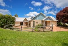  95 Fittler Close Armidale NSW 2350 Award winning energy efficient and passive solar home located in a tightly held family oriented part of Armidale. Architecturally designed, "Allunga" is a purpose built home dedicated to providing an energy efficient living environment for the New England climate and specifically designed as an accessible home. North facing, the living dining and kitchen areas connect to create a flowing open plan space that is great for entertaining. Polished concrete floors and internal masonry walls capture heat from the sun through the day to assist in heating the home. Double doors open onto a paved courtyard area overlooking native and private gardens. The kitchen features induction cooking, alongside an in-wall oven, dishwasher, full walk in pantry alongside disability access benchtops. Three bedrooms contain built-in-robes and carpet floors. The master bedroom features a walk-in robe and ensuite that includes a toilet shower and vanity. The main bathroom includes a separate inbuilt bath, accessible shower, toilet & raised vanity. Both bathrooms have in-slab heating. Custom built Western red cedar windows and doors feature throughout the home with some offering double glazing. As part of the accessible design issues, all floor finishes are flush throughout, including access to the front paved courtyard, with accessible height benches in laundry and kitchen, fully accessible bathroom, and lower handles and switches for easy access. A true feature of Allunga is the highly efficient geothermal heat pump system that extracts heat from underground and repurposes it through ducted air vents into each room, providing both heating and cooling. Also on offer is a solar hot water tube system further adding to the overall efficiency of the home, with the tank inside an airing cupboard. An extra wide lock-up garage provides internal access to the main residence, with a formed and paved driveway. NBN is also connected to the property. 