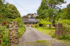  506 Mount Macedon Rd Mount Macedon VIC 3441 $1,390,000 A charming circular driveway and lush gardens spanning the wide frontage showcase an imposing street presence which introduces a property of rare attributes in a desired setting. The substantial residence boasts an abundance of accommodation with multiple living zones that all enjoy garden outlooks over the vast allotment. The floorplan commences through entrance hallway which leads to formal lounge and separate dining room. The modernised kitchen which includes stainless steel appliances is open plan with the living room and adjoining meals area. Master bedroom with ensuite and walk in robes plus four further bedrooms all with robes are serviced by two additional bathrooms which have been recently renovated. Carport and portico provide convenient parking spaces. Alfresco area opens out onto the deep rear gardens that boast numerous spaces for relaxed living and quite enjoyment whilst providing exciting potential. A coveted lifestyle location on the Golden Mile. 