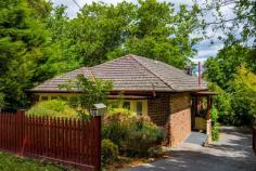  16 Penrose Rd Bundanoon NSW 2578 $1,450,000 Set well behind a picket fence sits this gorgeous double brick cottage which has been sympathetically renovated and extended offering a wonderful flow from the old residence to the new substantial extension. The character cottage houses three double bedrooms, the master having a full new ensuite, bathed in northern sunshine whilst the remaining two beds are serviced via the main period style bathroom with claw foot bath, shower over bath, pedestal vanity and wc. Off the bedroom wing is the cosy formal lounge, a versatile space and easily converted to home office or library room, warmed by the open fire and full of the character features of a home of this era. The extension houses the new kitchen finished with quality appliances, huge island bench, pressed metal splash back and a large galley style butler’s pantry with space for laundry. The expansive new living and dining space flows seamlessly off the kitchen with direct access to the elevated rear deck overlooking the established rear garden and local outlook. Directly off the kitchen and tucked away in the front garden amongst the dappled sunlight is a secondary entertaining deck perfect for weekend BBQs or your morning coffee. Heating is via the zoned ducted gas system, open fire and slow combustion fire to the rear extension. The residence is double brick which offers excellent insulation qualities and the extension also offers double glazing. Timber floors throughout with high decorative pressed metal ceilings to the original cottage which have been lovingly restored. Fret work, ceiling roses, high skirtings and leadlight windows are just a few of the charming features of this gorgeous home. Via internal stairs, under the house is massive and houses the double garage with auto panel lift door, workshop space and another laundry space option. Externally there is a small garden shed or studio set amongst the tiered garden of established ornamentals and open lawn areas ensuring year round colour and privacy. Full concrete driveway with turning bay plus further under house storage via the original laundry room now a great space for a potting shed if needed. Fabulous location within an easy stroll to the village shops, station, school and cafes. 