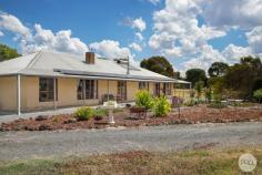  443 Brays Road Ross Creek VIC 3351 $975,000 - $1,025,000 This is a wonderful lifestyle property that has an excellent layout across the entire 20 acres with a large 4-bedroom country home. Horses, livestock, motorbikes or simply enjoy escaping the rat race and take in the country air, the choice is yours. Boasting 4 large bedrooms and plenty of natural light with either walk in robes or plenty of space for free standing cupboards. All bedrooms have ceiling fans with 2 of the bedrooms having their own ensuite with toilet, vanity and shower. The master includes an additional parents retreat space that could also be a perfect nursery for a newborn. The kitchen overlooks the living and second dining space with ample timber cabinetry that goes all the way to the ceiling. Enjoy the best of both modern and timeless kitchen features with an iconic wood fire Home Stead oven as well as a modern dishwasher with 900mm gas cooktop and electric stainless-steel oven in the oversized pantry. Formal dining area is at the front the home and it separated by a wonderful open wood fire petition that faces the spacious rumpus area currently being used as a pool room. The entire home is serviced comfortably by an additional fan forced wood fire and gas ducted heating with 12 outlets throughout the residence. Outside you have an enclosed backyard with dog run, surrounding veranda around the entire home and water tanks holding 120,0000 litres. Each of the 8 paddock has a horse trough with water that comes from the spring fed dam. All paddocks have equine sighter wire fencing with horse safety gates. Saddle up near the tack room with 3 stables and practice on the Olympic sized dressage space. When you get back wash your 4-legged friend on the concrete wash bay that is available Every country property needs a decent shed and with a 10mx10m workspace that has power and concrete you won't be disappointed. Perfect space to store all the toys. 