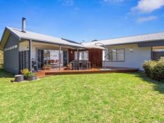  36 Ash Ave Sandy Point VIC 3959 $1,000,000-1,100,000 Superbly sited on approx. 785m2 block offering total privacy in an exclusive quiet court. Fully fenced and hedged to ensure you can enjoy the sundrenched north facing deck and sheltered garden setting year-round. Expansive open plan living space with sliding doors out to the alfresco entertaining area, the charm of a wood heater plus the convenience of a RC/AC and easy care timber look flooring. Well appointed kitchen with abundant bench and storage space, dishwasher, gas hob and wall oven. Three extra large bedrooms, master includes a full wall of robes, stylish ensuite and separate w.c. Main family bathroom, separate w.c. and laundry / utility room. Study or 4th bedroom accessed via side deck and with high speed NBN - an ideal place to work from home. Double carport, LU garden shed plus LU storage shed ideal for bikes and boards, wood shed and outdoor shower. So many environmentally friendly features including double glazing, 6 star energy rating construction, 4kW solar power system, tank (with filtration) plus bore water for garden, solar hot water. Being sold furnished by negotiation and ready to enjoy immediately. This one ticks all the boxes for even the most fastidious of buyers. 