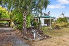  4 Torpy Avenue SNUG TAS 7054 $625,000 - $675,000 Positioned on a large and level 1407m2 block and a leisurely stroll to exquisite esplanade views or the lapping shores of Snug Beach, this 1950’s family home is just waiting for you to unleash the impressive potential on offer. There is much more here than meets the eye so let’s take a look inside. At a generous 161sqm the existing floor plan incorporates a large kitchen, which firmly anchors separate and spacious living areas. A sweet and cosy sunroom is the perfect spot to sip your morning coffee, or step to outdoor living, ideal for gathering with guests as you host celebrations in your new home. Two generously proportioned bedrooms and a bathroom also grace the layout, and outdoors a garden shed and two carports provide vehicle accommodation and storage. Discover existing fruit trees and more on this huge allotment, and the gardener in your family will be able to implement the glorious garden design they have always dreamed of. Presenting versatile options for remodelling and refurbishment, the possibilities are endless with how to embrace this unique offering. Renovate to create your own family sanctuary. Showcase original features, such as the open fireplace, timber doors and architraves to enhance the existing character. Or blend carefully curated improvements to create a showcase of contemporary style. The choice is yours. This is a location to love. Meander alongside the river, or head to the beach for your morning walk. This exceptional location provides the ultimate in convenience too. Walk to local shopping, bus and Snug Primary School, and you’ll find all that is on offer in this beautiful part of the Channel area within easy reach. So don’t hesitate, with only a handful of properties currently on the market in delightful and desirable Snug, this home won’t last long. Call today to arrange your private inspection. • 1950’s family home with enticing potential in fabulous Snug location • 161sqm of living on a large and level 1407m2 block • Ideal for renovation or remodelling • Walk to bus, local shopping and Snug Primary 