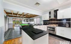  76 Britannia St Umina Beach NSW 2257 $1,100,000 - $1,175,000 A great family home with multiple living options & designed with entertaining in mind. Perfectly located less than 150m to the new Lone Pine Plaza shops which is under construction. - Three good sized bedrooms all with built in robes and a study or small 4th bedroom with a built in robe - Ensuite to the main bedroom - Spacious modern kitchen with granite benchtops, large oven with gas cooktop, pantry, plenty of cupboard & bench space and with breakfast bar - Main living area upon entry to the home with cypress pine timber floors - Zoned ducted air conditioning & back to base alarm system - Huge dining area off kitchen currently used as a billiards / pool room - Main bathroom combined with the laundry - Large rumpus room at the rear with wet bar leading onto the large covered entertaining area - The entertaining area overlooks the saltwater inground pool - Secure double tandem carport at the side of the home with ample off street parking All located within a level 1km stroll to Umina Beach shopping strip & less than 1.5km to Umina Beach. This is the perfect family home, don't miss out. 