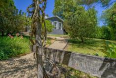  81 Railway Ave Bundanoon NSW 2578 $1,395,000 Set in a prime, elevated position ensuring privacy and perfect northern sunshine, this gorgeous timber cottage has been lovingly restored and will pull at your heart strings from the sun soaked entry to the rear garden. Highly sought after northerly aspect to the entry and sunroom which accesses the generous centrally located living / dining area via double sliding doors with fireplace and split a/c. The galley kitchen overlooks the garden and rear sandstone terrace perfect for entertaining and offers a gas cook top, electric oven, dishwasher, large walk in pantry and flows directly off the living space. All three bedrooms are doubles with built ins plus cute ensuite off the main or guest room whilst the remaining two beds are serviced via the stunning NEW bathroom with egg bath, shower over bath, wc, gorgeous marble topped vanity and herringbone tiled walls. The European style laundry has also had a full makeover and makes excellent use of the space with a frosted glass door to the rear terrace and clothesline. Further features of this charming cottage are the high ceilings, timber floor boards throughout, freshly painted interior / exterior and roof, timber windows and newly renovated main bathroom. Two street frontages plus a large level parking bay at the rear with double carport and space for a new garage or workshop accessed via William Street, leaves scope for more additions if needed. The stunning tiered garden with established hedges, trees and level grassed areas ensures ongoing privacy, space for the family and pets with the added bonus of a lovely local outlook. Only metres to the village shops, station and school this charming cottage could be your tree change, downsizer or weekend getaway.  