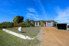  100 Burton Road Castletown WA 6450 $450,000 Situated on a massive 1257sqm elevated block, this delightful 3 bedroom, 1 bathroom brick home boasts an open plan living area with tile fire, creating a cozy atmosphere during colder months. It is also equipped with reverse cycle air conditioner, ensuring year-round comfort. Complete with a functional kitchen and well-proportioned bedrooms the main including a walk in robe. Garage under the main roof as well as side yard access that leads to a 6m x 4m shed. 