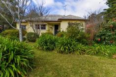  73 Railway Ave Bundanoon NSW 2578 $1,195,000 This character 1950s weatherboard cottage set in a pretty Highlands garden will pull at your heart strings. Retaining all the charm of years gone with the modern conveniences one would expect. Easy level living plus a short stroll to village shops, cafes, station and school. High points Excellent northern aspect ensuring a warm sun filled home Three generous living spaces all of which flow seamlessly to one another and the newly renovated kitchen Vintage gas Aga is a highlight of the kitchen/dining space, perfect additional cooking appliance and warms the home Kitchen overlooks the front and side garden and has direct access to the sunroom and entertaining deck Cosy lounge also accesses both dining and sunroom via French doors and warmed via the slow combustion fireplace, a great winter room All three beds are generous in size and offer varying degrees of storage options from small cupboards to gorgeous ornate robes with built-in dressing table Both bathrooms are in good condition, the main bath houses a bath, shower, wc and pedestal vanity whilst the second bath also offers the European laundry Adding to the charm and convenience of the home is 9ft ceilings, timber floorboards, picture rails, split a/c in the family/kitchen space and all town services Externally the home offers a free standing studio, a great work from home space, a generous garden shed and a lovely paved rear terrace and pathway through the garden Parking is via the double carport with plenty of extra off street parking if needed Fully enclosed rear garden perfect for pets plus a lovely array of trees, shrubs and garden beds 