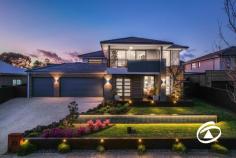  20 Oakview Blvd Narre Warren North VIC 3804 $1,750,000 - $1,800,000 Situated in an exclusive tree-fringed boulevard at the highly sought-after Oaktree Rise Estate, number 20 Oakview Boulevard projects a commanding presence from its wide-fronted 884m², elevated setting. Of immediate attraction is its superb three-car garage with drive-through access for further vehicle storage. A wide, exposed aggregate parking apron permits ample family or guest parking too. Step inside and a wonderful light-filled and spacious interior beckons. Features include an independent lounge with stunning views across the adjacent wetlands, a fully fitted and beautifully functional home office/study with a downstairs powder room adjoining the family-sized laundry. A fully equipped theatre lounge is also featured, it includes chic window shutters and an acoustic ceiling panel with starry light board effects - a living room with appeal both day & night! Perhaps the most alluring aspect of the home is the kitchen and surrounds, featuring twin ovens, stone benches, a walk-in pantry/scullery, and an enormous full-length bench extending into the dining zone, making it an ideal space for casual family gatherings or serious culinary exercises - Flowing seamlessly to the outdoors as you step out through sliding stacker doors to the alfresco deck. A large, paved area is then joined by the fabulous heated inground swimming pool in a fully fenced enclosure. Low maintenance and hassle-free it’s sure to be a focus of outdoor life this summer! Upstairs there is the family retreat with a private balcony and a total of four double bedrooms. The generous master suite enjoys fabulous views and features his and her walk-in robes and a beautifully appointed ensuite. Storage is not an issue with all remaining rooms complete with walk-in robes, one provides a great option for guests or larger families with its own private ensuite. Relish the harmony of suburban living while remaining well-connected to urban amenities. Excellent schools, parks, shopping, and dining options are just a stone's throw away. Properties in this location never last long! Don't miss the opportunity to make this stunning home your own and embark on a new chapter of luxury living. 