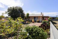  5 Begonia Place Sinclair WA 6450 $399,000 Enjoy the flourishing gardens that surround this brick veneer and iron, 3 bedroom, 1 bathroom home where all the hard work has been done for you! Open plan lounge with tile fire and adjacent kitchen and dining. Step out to full length, enclosed verandah/sunroom. Gated carport leads through to single garage/workshop. Limited traffic cul-de-sac location only 350m to local shopping precinct. 