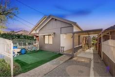  15A Lucerne Street Belmore NSW 2192 $1,250,000 - $1,300,000 Bathed in natural light, this exquisite residence and secluded retreat duo are adorned with soothing neutral tones, intricate cornices, polished timber floors, and surrounded by lush greenery. It offers an inviting haven for families to thrive, entertain, and create lasting memories with versatile living spaces. Conveniently situated within walking distance of Belmore Station, Belmore North Public School, Belmore Boys High, and charming local cafes. * Effortlessly flowing living and dining area featuring a cozy fireplace. * Elevated veranda with elegant downlights overlooking the child-friendly backyard. * A private entertainer's paradise, adorned with fragrant lemon trees. * Well-appointed kitchen with stainless steel gas appliances and ample storage. * Three generously sized bedrooms, one boasting a mirrored built-in wardrobe. * Contemporary bathroom with original floor-to-ceiling tiles, plus an additional external bathroom. * A secluded retreat complete with a welcoming front porch, spacious walk-in wardrobe and a cozy living area. * Abundant storage options, including a sizable attic space and internal storage. * Single carport and off-street parking available, fully enclosed front yard. * Just moments away from parks, recreational facilities, local schools, grocery stores, and an array of dining options. 