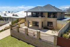  49 Karinga Rd Madora Bay WA 6210 $899,000 Nestled on Madora Bay’s prime elevated landscape, behold a pristine two-story home that seamlessly blends luxury, functionality, and relaxing ocean views. This meticulously crafted home exudes sophistication with its stone-finished façade, an inviting aggregate driveway, and meticulously landscaped limestone surroundings. Key Features: Elevated Elegance: Enjoy the expansive views from this Oceanside two-story home. Generous Living Spaces: Boasting four spacious bedrooms, two bathrooms, and 4 distinct living areas, this home caters to modern family needs. Masterful Retreat: The upstairs master bedroom is a true haven, featuring a walk-in robe, built-in wardrobes, an ensuite, a private balcony, and ocean views. Entertainment Hub: Revel in rear-view living that seamlessly connects with expansive alfresco and patio spaces, complete with an outdoor jacuzzi and shower. Designer Kitchen: The modern kitchen boasts a gas cooktop, stainless steel appliances, and a spacious walk-in pantry, elevating culinary experiences. Flexible Entertainment Zones: the home comes complete with a theatre/games room, a generous home office or 5th Bedroom, an open-plan kitchen, dining, and lounge with stunning polished concrete floors plus an upstairs lounge/retreat. Every space is designed for comfort and style. Year-Round Comfort: Stay cosy with an inbuilt gas log fire and reverse cycle ducted air-conditioning throughout the home. Seamless Indoor-Outdoor Living: The property offers a massive gabled patio with drive-through access, ensuring ample under-cover storage and parking. The children and pets will love the private and expansive backyard. There is also ample room in either the front and back yards to insert your dream pool. Unwind in Luxury Escape to your dream coastal home where every detail has been carefully curated for a lifestyle of comfort and sophistication. Don’t miss the chance to make this spectacular property your own – your coastal paradise awaits. 