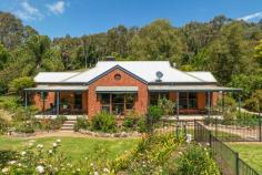  9 Greens Lane Myrtleford VIC 3737 $1,370,000 Nestled in the undulating hills of the Buffalo valley, this enchanting 4-bedroom, 2-bathroom retreat offers a unique blend of rustic charm and modern comfort, inviting you to immerse yourself in a serene country lifestyle. Spread across a generous 6.408 acres of meticulously manicured land, this captivating abode exudes warmth and tranquility at every turn. As you step inside, you are greeted by a seamless fusion of rustic elements and contemporary design. Cedar windows and doors frame the exterior, perfectly complementing the natural beauty of the surrounding landscape. The heart of the home is the open-plan kitchen, dining, and living area - the use of natural elements and light create an inviting and familiar ambience all homes seek. The master bedroom is secluded from all others room offering priceless privacy and boasts an ensuite and walk-in robe for ultimate convenience. Bedrooms two and three feature built-in robes for added ease and the main bathroom showcases a luxurious corner spa bath and walk-in shower. The fourth bedroom positioned off the laundry is a whimsical retreat featuring a walk-in robe adorned with a rustic barn door and a split system for year-round comfort. A quaint study nook also located in this private entrance to the home offers a dedicated space for work or relaxation. Year-round comfort is guaranteed with new ducted evaporative cooling and zoned floor heating, allowing you to enjoy the changing seasons in style. Venture outside to a haven of outdoor bliss, where a sparkling salt-chlorinated in-ground pool awaits, complete with a character-filled bar area and new pool equipment. Intimate seating areas scattered throughout the property provide perfect spots to unwind amidst the picturesque surroundings. The outdoor oasis continues with an undercover BBQ area featuring a charming chiminea, ideal for alfresco gatherings with loved ones. A spacious workshop/shed with a double carport offers ample space for vehicles, tools, and hobbies, embodying the essence of country living. Meticulously maintained gardens bloom in vibrant hues, creating a kaleidoscope of colors and scents, while a fire pit sitting area and tranquil ponds beckon moments of peaceful contemplation. Practicality meets luxury with 16 taps drawing water from a 60m bore, ensuring a constant water supply, and 24 solar panels generating 4.7Kw, minimizing your environmental impact. This property is a testament to the perfect marriage of rustic elegance and rural tranquility, offering a sanctuary where charm meets functionality. Embrace the serene beauty of this acreage retreat and turn your dream of a country escape into a reality. Additional features include: Two shipping containers for ample storage Vegetable garden Childrens playground Garden shed Chicken enclosure 