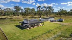  145 Jabez Hill Road Guyra NSW 2365 $700,000 - $770,000 Nestled amidst the serene landscape of the picturesque town of Guyra, lies a charming haven awaiting its new occupants. Presenting a blend of rustic charm and modern comforts, this three-bedroom family home offers a tranquil retreat from the hustle and bustle of city life. Key Features: Spacious Interior: Step inside to discover a light-filled and airy open-plan layout, seamlessly connecting the kitchen and dining area. The polished floorboards exude warmth, while expansive windows frame breathtaking views of the surrounding countryside. Comfortable Bedrooms: This home boasts three inviting bedrooms, two of which are equipped with built-in wardrobes, offering ample storage space for your convenience. Relaxing Retreat: Unwind after a long day by the cozy wood fireplace, creating the perfect ambiance for relaxation and rejuvenation. Outdoor Delights: Indulge in the beauty of nature from the wrap-around veranda, offering sweeping 360-degree views of the expansive property. Whether you’re enjoying your morning coffee or stargazing at night, this outdoor space is sure to enchant. Modern Amenities: The kitchen features gas cooking and overlooks the dining area, ideal for culinary enthusiasts. Additionally, the home is equipped with gas hot water, ensuring comfort and convenience for the entire family. Sustainable Living: Embrace off-grid living with solar power and battery storage, minimizing your carbon footprint while enjoying uninterrupted electricity supply. Two rainwater tanks and a bore with a pump provide a sustainable water source for your household needs. Ample Storage: Accommodate your vehicles and equipment with ease, thanks to the three-bay car garage and machinery shed, offering plenty of space for storage and hobbies. 