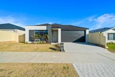  11 Lincelles St Madora Bay WA 6210 $749,000 Located in the highly sought after suburb of Madora Bay, this stunning 4 bedroom, 2 bathroom home built in 2021 by Smart Homes, offers an ideal opportunity for those seeking a sea change. The spaciousness of the home is truly highlighted by the impressive 31c ceilings in the main living areas, allowing natural light to flood the open plan family, dining, and kitchen areas, creating a bright and airy atmosphere. The centrally located kitchen features elegant stone benchtops, 900mm stainless steel appliances, a scullery and an abundance of cupboard space, ensuring a pristine and clutter free space. The master suite features a spacious walk-in robe, providing ample storage, while the ensuite is a standout feature with a double shower, double vanity, and a separate toilet, offering a private space to unwind and rejuvenate after a long day. Towards the rear of the home, an activity room connects to the three minor bedrooms. Bedroom 2 includes a walk-in robe, and bedrooms 3 and 4 are fitted with built-in robes. This area also includes the main bathroom and toilet, ensuring privacy and comfort for everyone. Additional features include a theatre room with double door entry, perfect for movie nights with friends and family as well as solar panel and Fujitsu ducted reverse cycle air conditioning for year round comfort and energy efficiency.  Situated on a 450 sqm block with a 3.6 metre side access, ideal for storing the boat or caravan, and a double garage with extra height and a workshop area, providing ample space for storage and DIY activities. Don't miss your chance to own such a beautiful home located within walking distance to the upcoming St Marcellin's Catholic College that is currently under construction, the picturesque Madora Bay Foreshore, and the vibrant Lakelands Shopping Centre. 