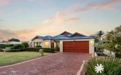  32 Brabham St Gosnells WA 6110 $775,000 Be impressed upon your first viewing! A mammoth of a home, 2009 built and designed stunningly to have incorporated architectural flair from the moment you first enter while arguably one of the best homes in the suburb. A must see for those seeking the best in family and guest entertaining! Upon entry you are greeted with beautiful quality flooring and a modern colour scheme. The practicality of the custom floor plan is perfect for all occasions, with an abundance of separated living spaces to allow for multiple ways you could live within this one of a kind home. Cinematic entertainment is ripe at 32 Brabham Street with a generously allocated space that is closed off with double doors and intelligently carpeted for those theatre like effects you will soon have the chance to experience. Modern from its inception, the kitchen is equipped with stainless steel appliances that includes a brand new oven and brand new double draw dishwasher, a large double door fridge recess with plumbing for the ice and cool water features. An island bench which allows you to view the wide spread of entertaining areas, to then incorporate plenty of overhead cupboards and storage. Your main living area includes a designated bar area for cocktail making that flows into the main family room, the large dining room then overlooks the timber lined alfresco which can accommodate the largest of gatherings to then flow into another open games room. The bedroom 1 boasts a true resort style ensuite, featuring a large double basin vanity, double shower, a corner bath and large double WIR’s. Another three generously sized bedrooms are present two of them with built in robes, a large laundry with a great amount of storage options and close proximity to the shared bathroom, all designed to be future proof for the new owners which ever way you choose to accommodate your family. The outside of this home is a showstopper! An Impressive entertaining space with minimal maintenance needed. The timber lined alfresco encumbers a remarkable space to enjoy Perth’s balmy nights, admire the extended pitched patio which will be for endless evening parties and gatherings, you’ll also have the outdoor kitchen to utilise when the kids are in the pool. Manicured lawns are ready for fun and no detail has been overlooked with large sliding doors providing a seamless transition to the huge area of limestone style paving and the ever stylish glass pool fencing. The powered workshop has side access to the home for a motor bike or other toys to suit anyone who needs to keep them tucked away or an escape for the after work hobby. 