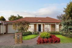  3 Cuneata Close Langwarrin VIC 3910 $880,000 - $925,000 Elegantly appointed, generously sized and curated for lifestyle lovers, this light filled Langwarrin oasis weds family friendly functionality with a host of high end upgrades across an alluring single level design. In a lovely residential estate just a short stroll to Langwarrin Park Primary School and The Gateway shopping mall, the four-bedroom residence sits amid tranquil gardens on an appealing 689m2 (approx) corner allotment. Having recently undergone a stunning modern makeover, the crisp and contemporary abode impresses with a choice of two spacious living areas, each opening to the alfresco, and a formal dining room. An exquisitely appointed cook's kitchen boasts stone benchtops, Asko dishwasher, Bosch induction cooktop, an oven and steam oven, while the woodgrain flooring, plush cream carpeting, light tones, lofty ceiling, exposed brick features and free flowing floorplan conspire to create fresh and inviting spaces. Dual sets of sliding glass doors open to the striking outdoor entertaining area between herringbone brick tiling and a high pitched pergola with a ceiling fan. Backdropped by a romantic outdoor fireplace, the terrace offers a European inspired elegance for exceptional open air hosting. Also spilling out to the garden, the master bedroom is fitted with a walk in robe and private ensuite, while the main bathroom indulges with a freestanding soaker tub, frameless glass shower and a marble vanity. With dual access on the corner block, the property provides both a double garage with a tradie's bathroom, along with an additional garage and caravan storage. Ducted heating, evaporative cooling, a wood heater and solar panels ensure all season comfort with affordability. Zoned for Elisabeth Murdoch College, the property is surrounded by parks, playgrounds, recreational facilities and public transport, around 3km to the freeway for easy commuting. 