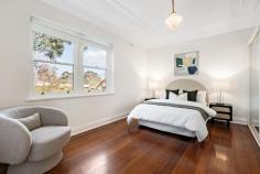  Flat 6/8 St Georges Grove Parkville VIC 3052 $660,000 - $720,000 Elevated and filled with light, this Art Deco beauty offers city convenience in a delightful parkside location. Ideally situated in a private cul-de-sac, this two-bedroom abode is one of only eight in a historic boutique apartment block with Royal Park on the door step. Immaculate and elegant, this appealing property is ideal for downsizers, investors or first-home buyers. Updated with charm and style, the spacious living area boasts soaring original ceilings with plaster mouldings and an ornate fireplace. A balcony with double glass doors opening out on the communal garden floods the space with light and breezes. The chef's kitchen boasts stone benchtops, chic tiled splashback, plenty of storage, stainless steel appliances and a retro meals area with bench seating. The two robed bedrooms both enjoy a leafy outlook thanks to large windows. The central bathroom, renovated with a nod to the Art Deco style, has a combination bath and shower, pedestal basin and a separate toilet. This charming property also features a remote-controlled garage, original floorboards, secure intercom, split system heating and cooling. Walk to the University of Melbourne, The Royal Children's Hospital, The Royal Melbourne Hospital, Melbourne Zoo, Queen Victoria Market, Princes Park, the Royal Parade tram line and the Flemington Bridge Station. 