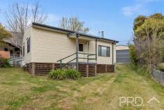  13 Ryan Street Talbingo NSW 2720 Positioned on the high side of the treelined street of Ryan, sits this well maintained high-set three-bedroom home. Boasting three great sized bedrooms, formal living, well maintained kitchen, ample heating and cooling options and a 6m x 10m colourbond shed with awning for additional covered parking or the perfect rear entertainment area. You will love the livability of this extremely well maintained three-bedroom home, in the heart of Talbingo. Do not miss your opportunity, call today to book your inspection! Premiere Features: - Three great sized bedrooms, with two offering ceiling fans and split system air conditioning - Centrally located and well-maintained bathroom with shower, single vanity and toilet - Kitchen with electric cooktop, ample storage options and bench space - Large formal living room upon entry with wood box fire, split system air conditioning and ceiling fan - Internal laundry with new flooring positioned to the rear of the plan - Mudroom with external access adjacent the laundry - Second separate toilet - Quaint covered timber entry - Gas hot water - Fully fenced and low maintenance yard - 6m x 10m colourbond shedding with additional awning running the length of the shed, perfect for additional covered parking or fully covered outdoor entertaining area - Garden shed - Additional wood shed - External power to the front of the home - Approximate 710m² allotment Do not miss your opportunity to secure this low maintenance and well maintained three-bedroom family home with all the modern creature comforts. 