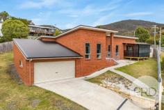  14 Garfield Road Glenorchy TAS 7010 $795,000 + Ultra modern home set on 791sqm - built in 2015 + 4-5 Bedrooms, main with WIR & ensuite + Open plan living area + Large covered entertaining area + Remote controlled front gates + Double garage and storage area/room + Walking distance to Glenorchy CBD + On bus route 