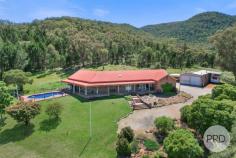  34 Stirling Road Tamworth NSW 2340 Welcome to 34 Stirling Road. This perfect slice of paradise is stretched out on a beautiful 8 acres and appeals to anyone that is wanting the peaceful country lifestyle a close distance from town. Upon entry to this expansive family home, you are greeted with a large veranda that offers you stunning views from the front, make your way inside to discover large country living comprised of five very generous bedrooms all with built in robes. Bedrooms one and two consist of a glass sliding doors out to the front veranda whilst bedrooms three and four include glass sliding doors to the covered outdoor area. The master bedroom has a large walk-through robe giving you enough space for him and her and a large ensuite attached with a built in spa bath. This home is not short on space with a massive dining area that flows off the kitchen and then through to another living space, down the opposite end of the home you will find another family area along side the main bathroom and laundry. Exposed brick is featured through out the home and the kitchen featuring wooden cabinetry with stained glass features. High ceiling throughout the home give you a luxurious and spacious vibe, you will find ceiling fans and evaporative installed along with a woodfire place and split systems in both the living area and the master room. Outside the large inground swimming pool is perfect for the coming summer months, there is also horse stables for the equine enthusiasts as well as a designated horse wash bay. The large double lock up shed provides a great space for a work shop and vehicle storage, you will also find a fully self containable studio/rumpus room with a kitchenette, ensuite and laundry this being the perfect teenager retreat, place to house guests or a second form of income as a rental / Air BnB. 