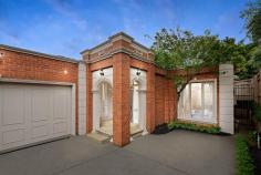  1A Grosvenor Parade Balwyn VIC 3103 $1,750,000 - $1,850,000 Situated in one of Balwyn's finest streets is this immaculate and elegant, single-level town residence offering generous family-friendly spaces in the coveted Balwyn High School zone. Moments from Whitehorse Road trams, Balwyn Village shops, cafes, cinema, freeway and parks, this impeccably presented home is sure to impress. One of only two, located at the rear, it has its own private walkway pedestrian access, ensuring privacy, security and lock-up convenience. Ideal for families, discerning downsizers and savvy investors, it features a large double living zone with classic proportions. This includes a formal sitting area with elegant plaster detailing and a gas fireplace ideal for intimate soirees or larger gatherings. The same high-quality finishes continue throughout the space, which also boasts a light-filled dining area and casual lounge with full-length windows leading out to a north-facing European-style paved courtyard. The chic entertainer's kitchen has stone benchtops, stainless steel appliances, a corner pantry and plenty of storage. Other amenities include a large laundry with storage, a central bathroom with separate bath and shower, and powder room. The three spacious robed bedrooms include a sumptuous master zone with ensuite featuring stylish stone flourishes, bath and shower and a walk-in robe. This distinguished abode also has polished brush box timber flooring, ducted heating, evaporative cooling, ducted vacuum, security, double garage with internal access and no body corporation fees.  Zoned for Balwyn Primary School and Balwyn High School, and with the city's best private schools in easy reach. 