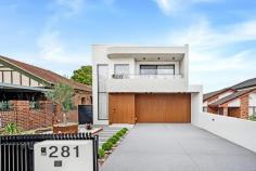  281 Dora Street Hurstville NSW 2220 Perched in an elevated position, this brand-new luxury family home is ideally located on a quiet street, just moments from Beverly Hills Public School and the train station. Built to the highest quality standards, the residence features double brick construction over two levels of contemporary living. The lower level includes a spacious living and dining area, flooded with natural light, creating a warm and inviting atmosphere. A generously sized bedroom at the front is perfect for large families or guests. Upstairs, you'll find four bedrooms, two of which have ensuites. The master retreat offers a walk-in wardrobe, a convenient ensuite, and access to a wrap-around balcony with stunning city views. The well-appointed family bathroom features a separate shower and an elegant freestanding tub, while an additional living space upstairs provides a cozy sitting area. The outdoor barbecue kitchen leads to a large alfresco entertaining area, ideal for gatherings. The chic gas kitchen is outfitted with marble benchtops and a butler's pantry, complemented by wall-spanning cabinetry and sunny balconies in the spacious bedrooms. Other highlights include ducted air conditioning, oversized feature doors, and tasteful tiling. This property also features electric gated entry to a large double garage with interior access, all within walking distance of local reserves, Beverly Hills CBD shops, and eateries. This is a rare opportunity to acquire a refined luxury home in one of Hurstville's most sought-after locations. Spacious open plan living and dining area bathed in natural light Expansive ceilings and abundant natural light throughout Modern stylish gas kitchen with marble benchtops and a butler's pantry Five bedroom, Three ensuite and built-in/walk-in wardrobes Master bedroom with ensuite, a sky light walk in wardrobe, wrap-around balcony and city views Striking bathrooms with brushed gold Nero tapware Ducted air conditioning, feature oversized doors and elegant tiling Outdoor barbecue kitchen leading to a large alfresco entertaining area Electric gated entry to a large double garage with interior access Conveniently located near local reserves, shops, and eateries in Beverly Hills 