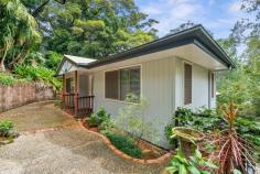  2 Lalina Avenue Tweed Heads West NSW 2485 Introducing a charmingly renovated two-bedroom, split-level home nestled in the serene surrounds of a great locale. This home is set on a massive 1208sqm block with a peaceful green outlook offering a tranquil haven that seems a world away from the hustle and bustle. Every corner of this delightful residence exudes warmth and comfort, from the gleaming hardwood timber flooring to the cosy living room, complete with air conditioning and a large window nook that invites the beauty of the outside in. The modern kitchen comes fully equipped with a dishwasher, microwave cavity, and breakfast bar, all framed by inspiring views of the verdant outdoors. The two generously sized bedrooms are carpeted for comfort and feature built-in robes for convenience. The main bathroom has been beautifully renovated, and there is a separate toilet for added privacy. Practicality isn't forgotten with a garden shed, a workbench under the house, and ceiling fans throughout to keep the home comfortable year-round. Parking is a breeze with a two-car carport, and the location couldn't be better. In close proximity to the local Seagulls club, Spar supermarket, bakery and butcher and only a 10-minute drive to the breathtaking Coolangatta beaches and vibrant city centre, this home is also within easy reach of the M1 for effortless commuting. The Coolangatta International Airport is just a short drive away, perfect for the travelling family. 