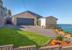  38 Cliff Drive Kiama Downs NSW 2533 $5,300,000 - $5,700,000 38 Cliff Drive, Kiama Downs is truly a distinctive home making its debut on the market. Lovingly maintained and renovated over the years, this property is positioned as the last house on the ocean side of an exclusive cul-de-sac. This well appointed tri-level beach home not only provides unparalleled privacy but unobstructed views that can never be built out. Enjoy the beauty of the ever changing landscape that comes with each season. As the waves curl around Bombo Headland, watch the surfers as they 'shoot the curl' towards the Boneyard, a beautiful secluded and safe swimming bay. This location offers endless activities at your fingertips: snorkelling, swimming, fishing, bike riding, walking or just relaxing. Host BBQs on the expansive deck, be entertained by passing whales and dolphins and wake up to breathtaking sunrises on the horizon. 