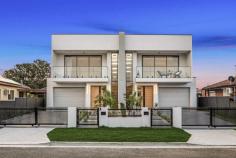  12A Ogmore Court Bankstown NSW 2200 $1,549,950 Welcome to this brand-new, tropical-inspired duplex, tucked away in a peaceful cul-de-sac in the heart of Bankstown. This architecturally designed home is the epitome of modern elegance and functionality, offering the perfect balance of style, comfort, and convenience for families. *Unmatched Design & Livability* Step inside to discover a light-filled open-plan layout, where the centerpiece is the beautifully crafted kitchen. Featuring: - A glass-enclosed walk-in pantry for seamless organization. - A breathtaking 3-meter stone island waterfall bench, ideal for entertaining or casual family meals. - Premium appliances, ensuring a chef's delight in every meal preparation. This space flows effortlessly into the outdoor alfresco area, complete with a covered pergola and a low-maintenance backyard- perfect for year-round entertaining or relaxing with loved ones. *Prime Location* Situated just a 15-minute walk from the upcoming Bankstown Metro train station (completion expected in 12 months), this home puts you within easy reach of everything: shops, schools, clubs, churches, temples, and more! *Key Features* - 5 Spacious Bedrooms: Four upstairs, including a luxurious master suite with an en-suite and walk-in robe. The fifth bedroom/ home office is conveniently located downstairs - ideal for guests or elderly family members. - Luxurious Electric Fireplace: A sleek centerpiece that adds warmth and charm to the living area, perfect for cozy winter evenings. - Sky-Lit Brilliance: Strategically placed skylights ensure an abundance of natural light, creating a bright and airy ambiance throughout the day. This property is not just a home; it's a lifestyle upgrade waiting for its new owners. Don't miss the opportunity to secure your dream family home in this highly sought-after location. 