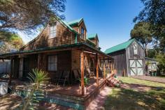  22 Birrahlea St Waratah Bay VIC 3959 $895,000 A character filled escape where the coast meets the country. Listen to the sounds of the surf and the wind in the trees - surround yourself with nature in this ideal location just a short stroll from the pristine coastline. With a wide verandah on every side, you can sit back and enjoy views of the native gardens, fenced fire pit area and covered BBQ space. The timber rich interior includes a living room with dado panelling and RC/AC. Gleaming brand new galley style kitchen with adjoining butlers pantry, dishwasher, and adjoining dining area with french doors connecting you to the outside. Master bedroom downstairs, ensuite to main bathroom. Two charming bedrooms upstairs with raked ceilings and dormer windows. Set on an approximately 702m2 block with a separate timber barn providing additional accommodation in the mezzanine loft accessed by a bespoke staircase, storage area and games room. If you are looking for a special place to relax and unwind whilst providing an immediate return from holiday rentals, this is a must see. 