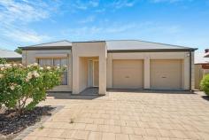  9 Kirra Ave Mitchell Park SA 5043 $859,000 to $899,000 Enjoying a wonderful position along Kirra Avenue just metres from local reserves and bus and train transport, this contemporary courtyard ticks all the boxes for modern living. Behind a secure gated frontage, a central entry allows easy access to a front positioned master bedroom – the first of three – complete with ceiling fan, walk-in robe and ensuite bathroom and lovely morning light, while bedrooms two and three are serviced by a central family bathroom with inset bath and shower. An open plan kitchen, living and dining space at the rear features shaker-style cabinetry, a gas cooktop, dishwasher, breakfast bar and plenty of storage space including a corner walk-in pantry. From here home cooks will have uninterrupted views of the living and dining area as well as sliding door access to both a rear pergola and expansive northerly alfresco entertaining space. Primed for hosting the most sizeable family gatherings, guests will be comfortable whatever the weather under the huge pitched roof pergola with bright northerly-aspect. More you'll adore: - Double garage with internal & side access - Additional secure driveway parking - Split system air conditioning - Solar panels - Separate laundry - Built-in robes + ceiling fans to bedrooms 2 & 3 - Casual second living area with northerly aspect and alfresco outlook With the Tonsley Innovation District (Flinders University & TAFE SA campuses) within walking distance, and easy access to local schools, shops, Westfield Marion, Castle Plaza, city and sea, this one gets a big tick for location. A stellar easy-care courtyard or investment. Snap this one up while you can. 