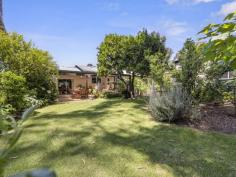  1 Mine Rd Foster VIC 3960 $495,000 Right in the heart of town, this delightful home is set on approximately 1105m2 with side access to a LU garage/workshop, making it ideal for caravan or boat owners. Every window frames pretty garden views and the covered patio is just the spot for alfresco entertaining while enjoying the outlook to Stockyard Creek. Light filled living room with wood heater, polished timber flooring and adjoining sundrenched study nook. Separate dining room (RC/AC) flowing out to the sheltered and private BBQ area. Central kitchen with modern appliances, timber benches, gleaming white cabinetry and abundant storage. Master bedroom with wall of built in storage, overhead fan and doors to a private deck. Huge second bedroom with space for a sitting or study area. Modernised main bathroom plus second w.c. off the laundry / utility room. Single carport. Just a short and flat stroll from the centre of town, this is a must-see if you're looking for a central location that still offers privacy. 