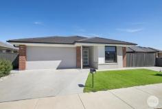  57 Moore Way Lucas VIC 3350 $625,000 - $645,000 PRD Ballarat is pleased to present 57 Moore Way, Lucas. A contemporary 4 bedroom residence designed for refined, low maintenance living in a sought after locale. With a seamless, well planned layout, this home offers a spacious master suite with a walk in robe and ensuite, along with three additional bedrooms featuring built in robes. The central family bathroom includes a bath, shower, vanity, and a separate toilet for added functionality. A sophisticated kitchen is at the heart of the home, equipped with a 900mm gas cooktop, electric oven, a dishwasher, and a butler's pantry, offering ample storage for the modern chef. The open plan kitchen, living, and dining areas create an inviting space for family gatherings, while a separate second living room provides a versatile retreat. Gas central heating and evaporative cooling ensure year round comfort. Step outside to a private alfresco area, ideal for entertaining and enjoy the ease of a fully enclosed, low-maintenance rear yard with astroturf and a landscaped front yard. The double lock up garage provides internal and rear access, enhancing security and convenience. Situated close to the Alfredton School Precinct, Lucas Town Centre, and Delacombe Town Centre, this property combines sophisticated living with unparalleled convenience. 