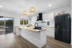  55 Trees Road Tallebudgera QLD 4228 $1,625,000  Your next exciting chapter starts right here, with this brand new, elevated beauty. Boasting enticing dual living on an 803m2 block, the main residence is fresh, modern, and light-filled, with abundant space to accommodate growing families. Functionality is paramount too, thanks to an open-plan kitchen, living, and dining zone. Prep meals on the timber benchtops while keeping an eye on children playing or take advantage of the large-scale slider doors and bifold servery window, facilitating an easy flow onto an alfresco balcony. Entertain or relax here as you overlook the lush valley views or retreat to a second protected outdoor terrace that adjoins the backyard. Alternatively, enjoy evenings under a starlit sky, gathering around the open-air firepit. Two spacious bedrooms with built-in robes grace the upper-level, with a sleek wet-room-style bathroom adding a dash of luxury and indulgence. Downstairs is a seperate living/ retreat with an additional bedroom and office accompanied by another modern bathroom. Versatility continues with a studio/bedroom that can be tailored to your desires, plus a separate 1-bed, 1-bath residence. Fully self-contained, it features an open-plan kitchen, living and dining zone and is ideal for extended family, guests or to earn a rental income. Just as impressive is the location. Leave the car at home and stroll to Man on the Bike for an Italian feast and avoid school traffic chaos, with Tallebudgera Primary approx. 5 minutes on foot. St. Andrew's Lutheran College is a quick car trip, and when you're craving the sand and surf, arrive at Currumbin Alley in approx. 10 minutes. Let this be your escape from the everyday hustle, and a place where cherished memories are made. Arrange an inspection today. Main House Features: Brand new, elevated residence infused with fresh, modern and light-filled interiors Expansive, open plan kitchen, living and dining zone, seamlessly flows onto the alfresco balcony Contemporary kitchen appointed with a gas cooktop, window splashback, timber benchtops, island bench, pendant lighting, black tapware and bifold servery window Two spacious bedrooms upstairs with built-in robes Sophisticated main bathroom boasts a wet-room-style rain shower and freestanding bath, floating stone vanity and separate toilet Alfresco entertaining balcony, overlooks lush valley views Laundry with large sink and storage Ceiling fans Double carport and driveway parking Seperate Living/Retreat Bedroom with bathroom Studio/ bedroom Outdoor entertaining area adjoining the backyard Second House Features: Light-filled, open plan kitchen, living and dining zone Kitchen includes a gas stove and oven, sink and ample storage Bedroom with built-in robe Modern bathroom with black tapware Private balcony Ceiling fans Property Features: Elevated 803m2 block in a peaceful setting Underhouse storage available Open-air firepit area NBN connection Location: Approx. 5 min walk to Tallebudgera State School and shops Approx. 3 min drive to St. Andrew's Lutheran College Approx. 9 min drive to Palm Beach Approx. 10 min drive to Currumbin Alley Approx. 12 min drive to Burleigh Heads Approx. 16 min drive to Gold Coast Airport 