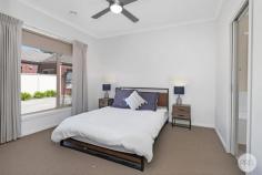  2 / 13-15 Learmonth Street Alfredton VIC 3350 $389,000 - $409,000 Positioned within walking distance to Aldi, Chemist Warehouse, Lake Wendouree, and Victoria Park, this beautifully presented townhouse offers the convenience of city living with minimal upkeep. The 9 foot ceilings create a sense of openness and light throughout. The open kitchen, meals, and living area flows easily to a private courtyard which is ideal for outdoor entertaining. With quality appliances, including a dishwasher, the kitchen is designed for functionality and ease offering great storage and ample bench space. Both bedrooms are spacious, fitted with built in robes, while the master bedroom offers direct access to the family bathroom with a separate shower and bath. This property will ideally suit those seeking a low maintenance lifestyle, investors looking for a reliable rental opportunity, or first home buyers ready to step into a well established Ballarat location. With central heating, split system air-conditioning, and a secure single garage, this home ticks all the boxes! 